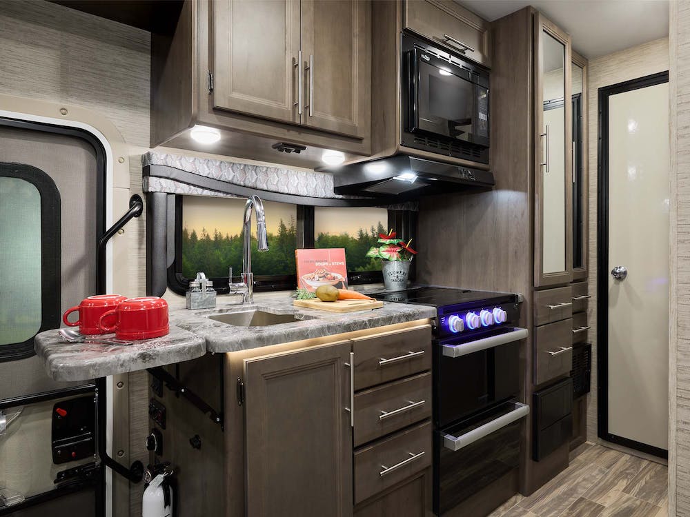 Outlaw Class C Black talon with weathered cherry cabinetry kitchen